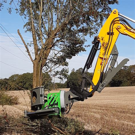 mini excavator tree shear|tree cutting attachment for excavators.